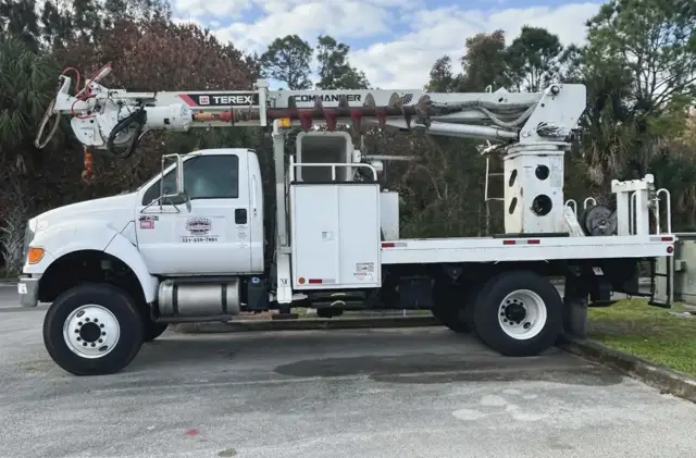 Our augur truck that allows us to set light poles and other poles for commercial uses.