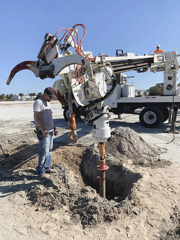 Setting parking lot lighting poles